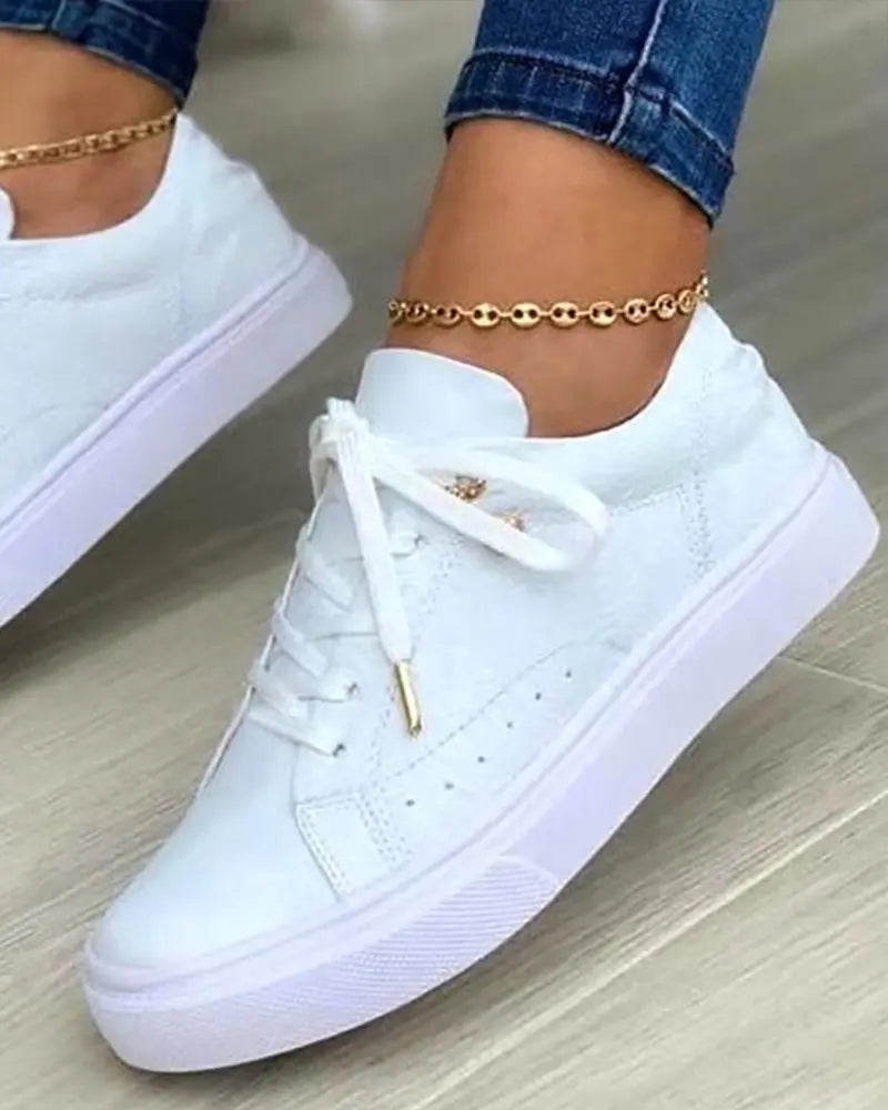 MW | Schicke Turnschuhe mit goldenen Details