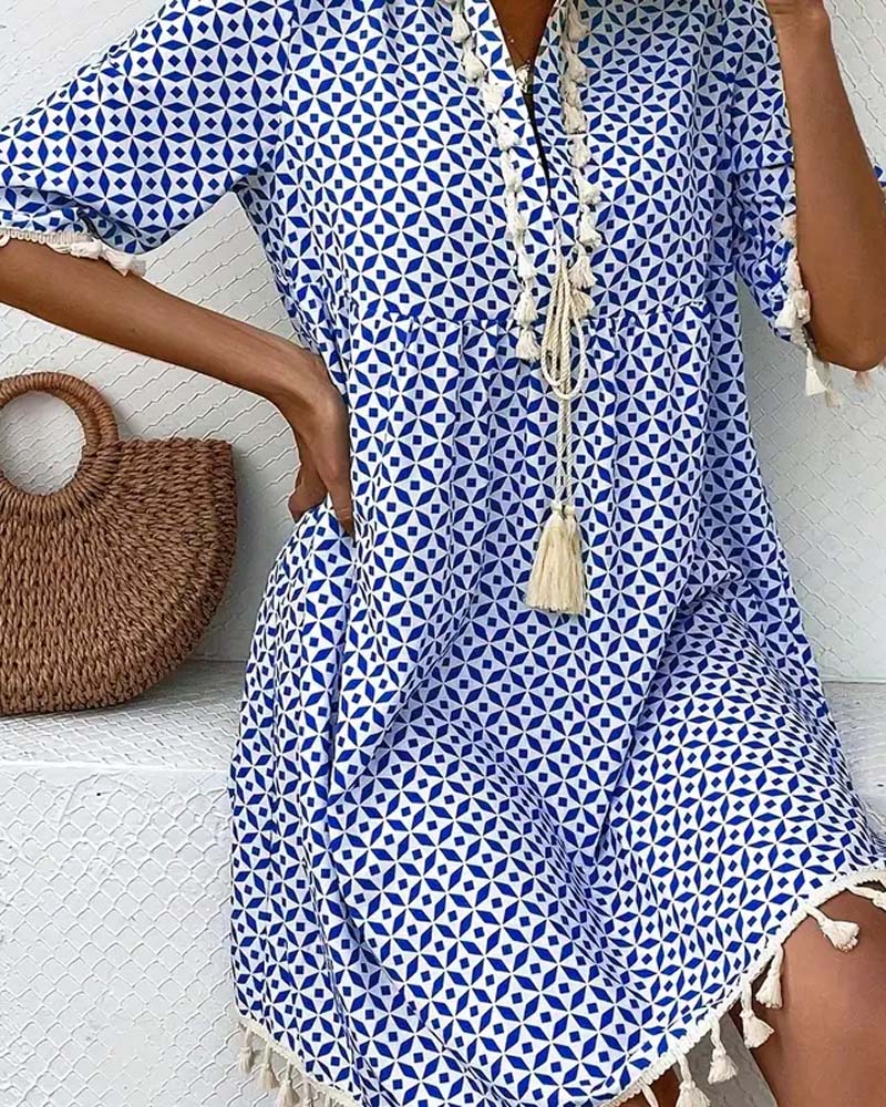 EM | Tania – Grooviges blaues Kurzarm-Minikleid