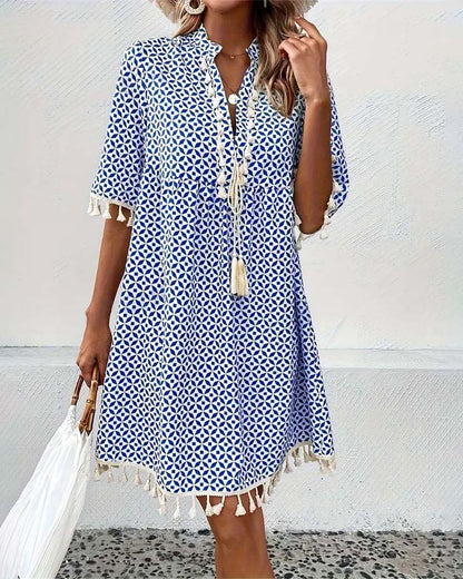EM | Tania – Grooviges blaues Kurzarm-Minikleid