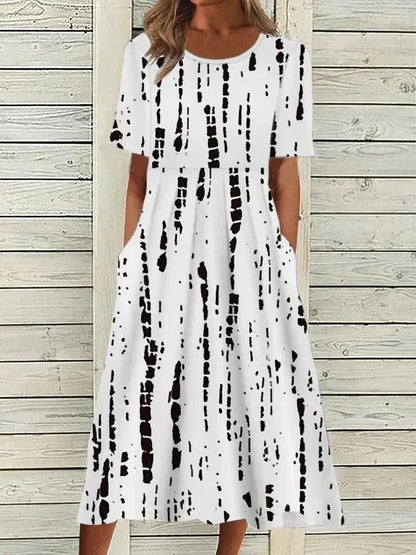 EM | Bedrucktes Midikleid mit Rundhalsausschnitt und Taschen